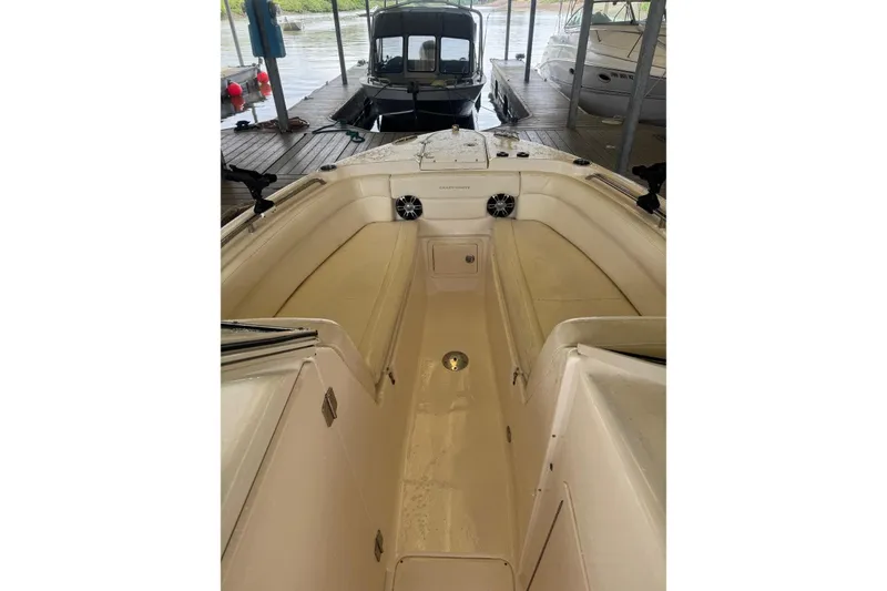 Slide: The Image of 2020 Grady White 275 Freedom boat interior at dock, showcasing seating and speakers. - 12