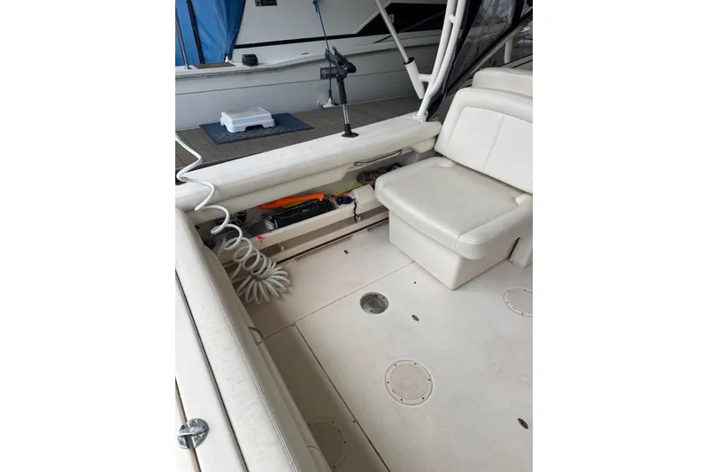 Slide: The Image of 2020 Grady White 275 Freedom boat interior with seating and storage compartments. - 6