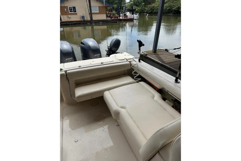 Slide: The Image of 2020 Grady White 275 Freedom boat interior with seating and twin 200 engines. - 7