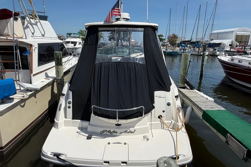Slide: The Image of 2009 Monterey 340 Sport Yacht docked at marina with American flag. - 11