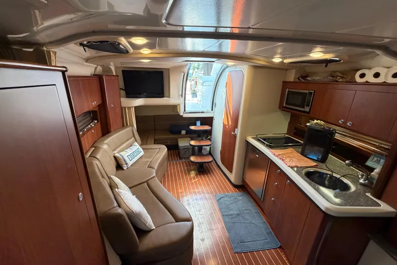 Slide: The Image of Luxurious interior of a 2009 Monterey 340 Sport Yacht with modern amenities and elegant design. - 32