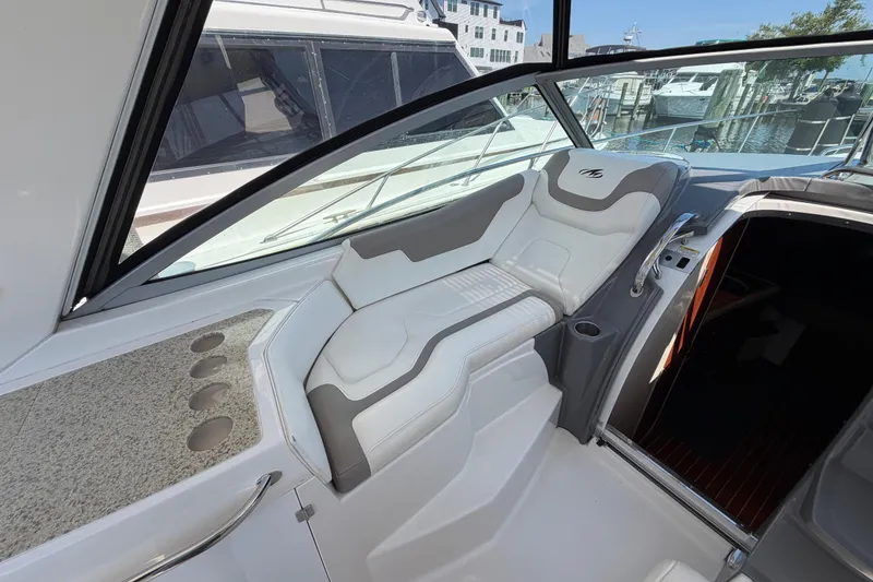 Slide: The Image of 2009 Monterey 340 Sport Yacht interior with sleek seating and modern design. - 22