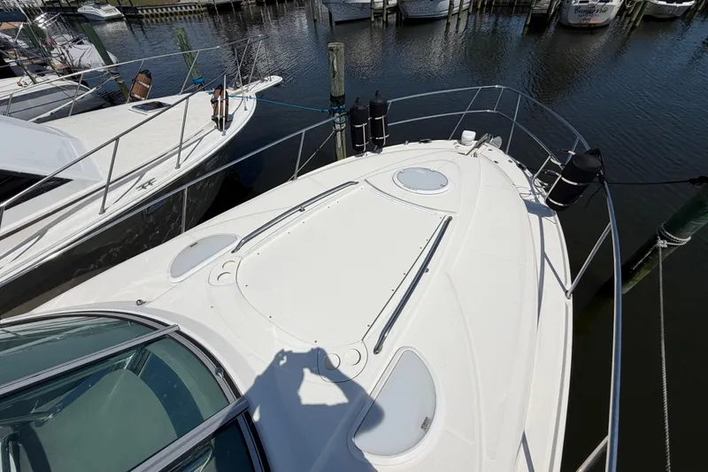 Slide: The Image of 2009 Monterey 340 Sport Yacht docked at marina, top deck view. - 40