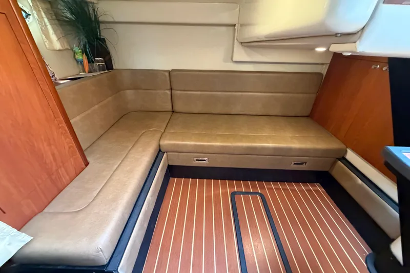 Slide: The Image of Interior of 2009 Monterey 340 Sport Yacht with beige seating and wood accents. - 36