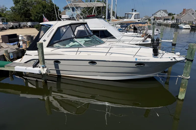 The Image of 2009 Monterey 340 Sport Yacht docked at marina, side view. - 6