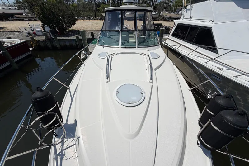 Slide: The Image of 2009 Monterey 340 Sport Yacht docked, showcasing sleek deck design and modern features. - 44