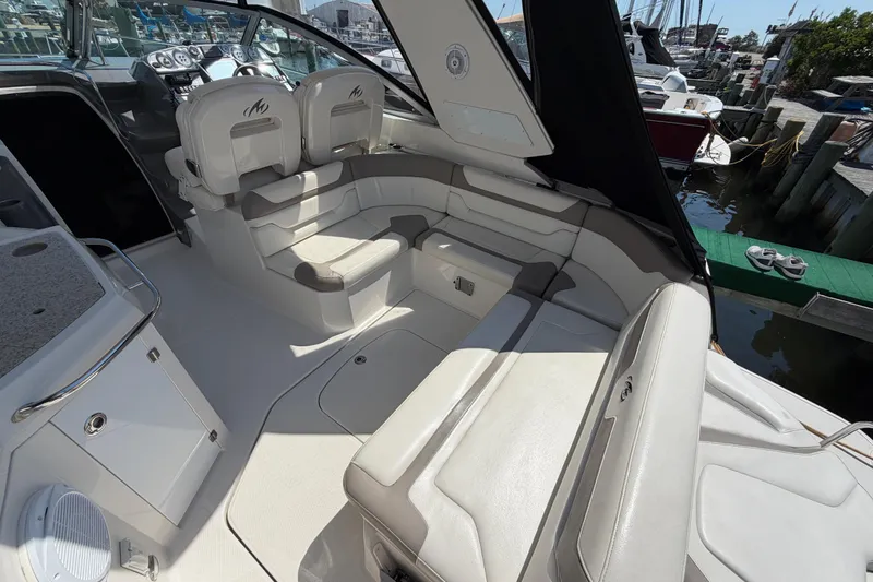 Slide: The Image of Luxurious interior of a 2009 Monterey 340 Sport Yacht with plush seating and modern design. - 18