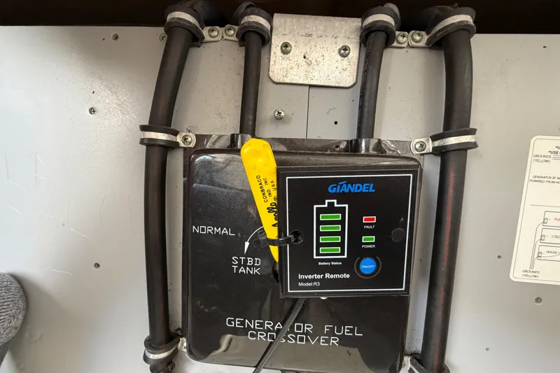 Slide: The Image of Inverter remote panel on a 2009 Monterey 340 Sport Yacht with fuel crossover controls. - 55