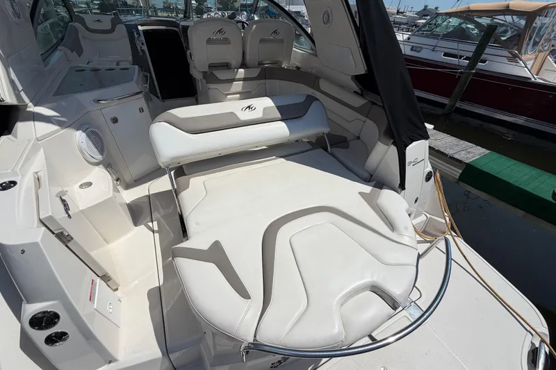 Slide: The Image of 2009 Monterey 340 Sport Yacht interior with white seating and modern amenities. - 15
