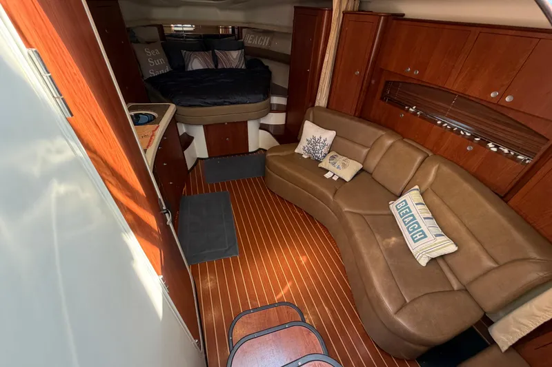 Slide: The Image of Luxurious interior of 2009 Monterey 340 Sport Yacht with leather seating and wood accents. - 27