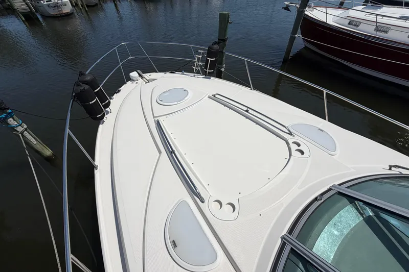 Slide: The Image of 2009 Monterey 340 Sport Yacht docked, showcasing sleek deck design and railing. - 41