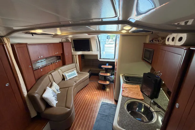 Slide: The Image of Luxurious interior of a 2009 Monterey 340 Sport Yacht with modern amenities and elegant design. - 33