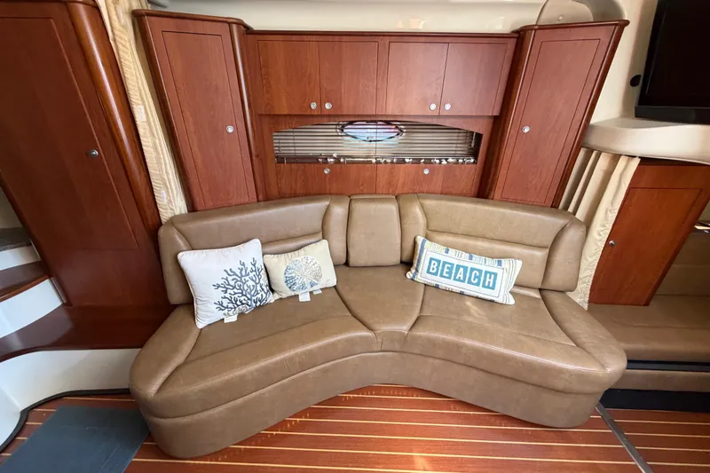 Slide: The Image of Luxurious interior of 2009 Monterey 340 Sport Yacht with leather seating and decorative pillows. - 28