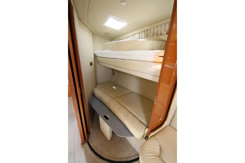 Slide: The Image of Interior cabin of 2000 Sea Ray 410 Express Cruiser with bunk beds. - 23