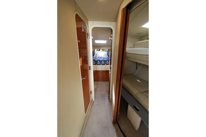 Slide: The Image of Interior view of 2000 Sea Ray 410 Express Cruiser with cozy cabin and bunk beds. - 24