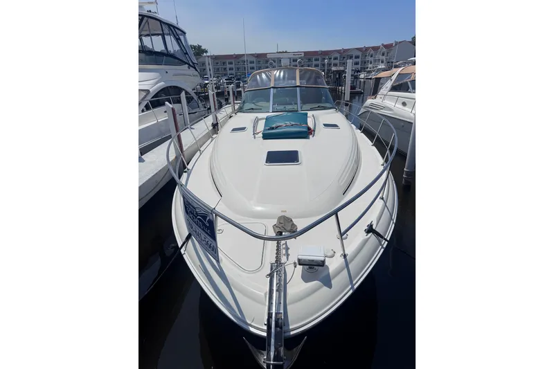 Slide: The Image of 2000 Sea Ray 410 Express Cruiser docked at marina, front view. - 2