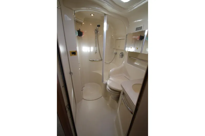 Slide: The Image of 2000 Sea Ray 410 Express Cruiser bathroom with shower, sink, and toilet. - 30