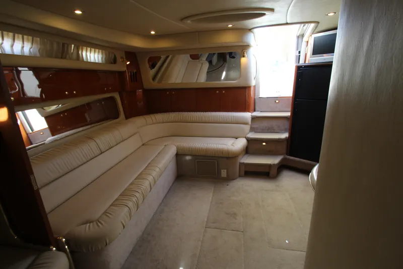 Slide: The Image of Luxurious interior of 2000 Sea Ray 410 Express Cruiser with plush seating and elegant design. - 38