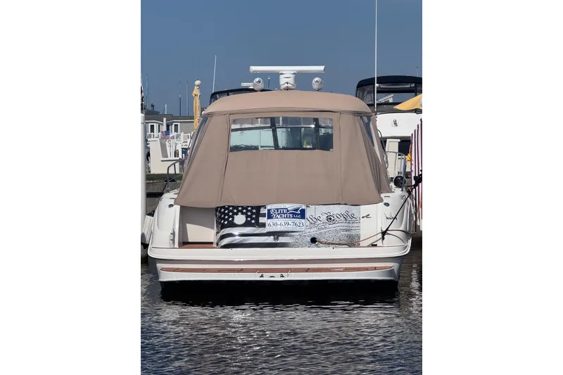 Slide: The Image of 2000 Sea Ray 410 Express Cruiser docked at marina, rear view. - 6