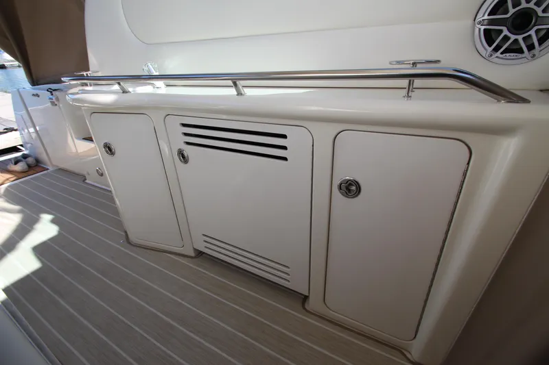 Slide: The Image of 2000 Sea Ray 410 Express Cruiser interior with storage cabinets and speaker. - 41