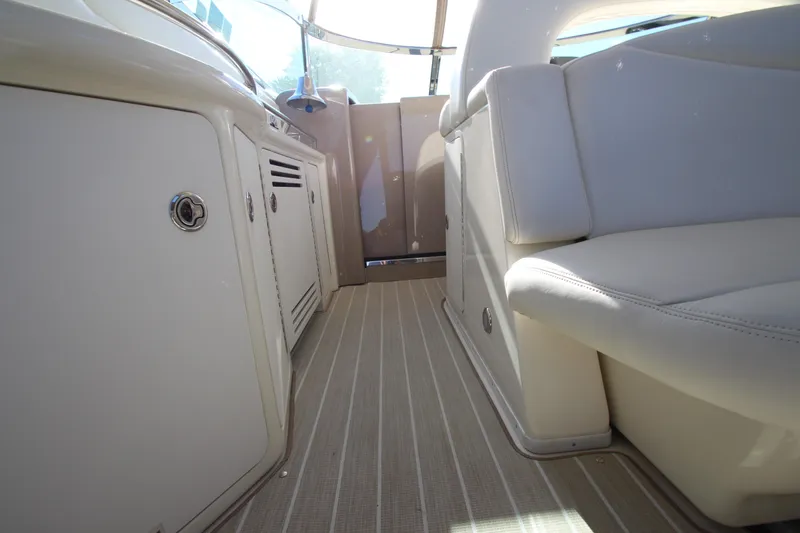 Slide: The Image of Interior view of a 2000 Sea Ray 410 Express Cruiser, featuring sleek cabinetry and seating. - 8