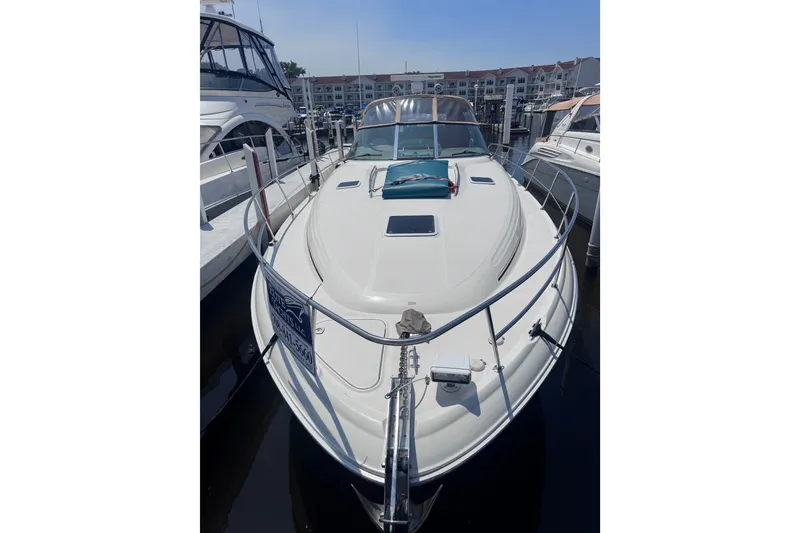 Slide: The Image of 2000 Sea Ray 410 Express Cruiser docked at marina, front view. - 5