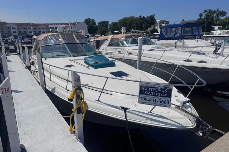 The Image of 2000 Sea Ray 410 Express Cruiser docked at marina, available through Elite Yachts LLC. - 0