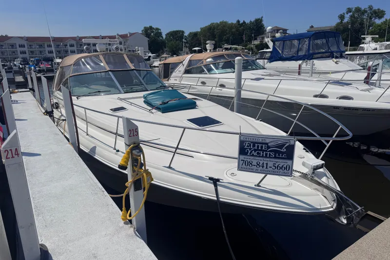Slide: The Image of Sea Ray 410 Express Cruiser 2000 docked at marina, available through Elite Yachts LLC. - 4