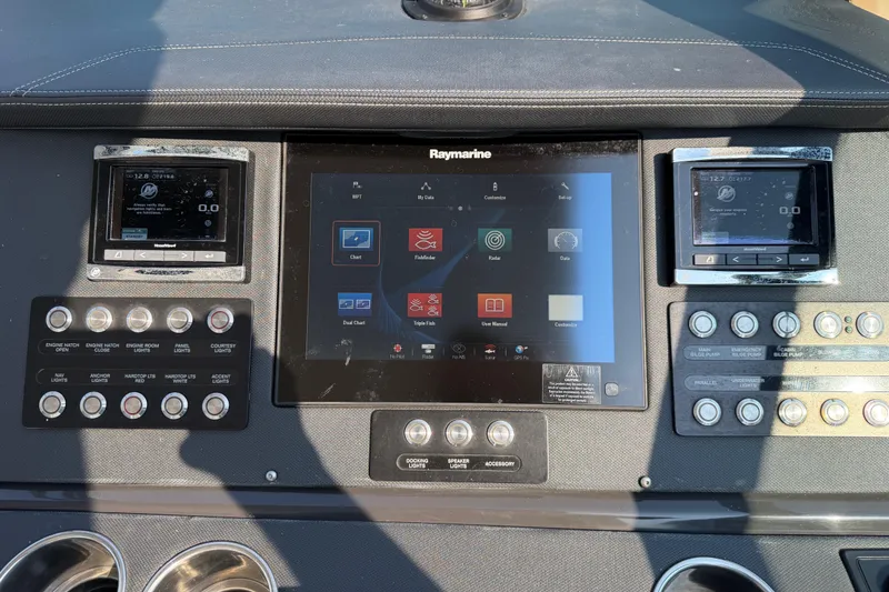 Slide: The Image of Control panel of a 2017 Monterey 378SE Super Express boat with Raymarine display. - 44