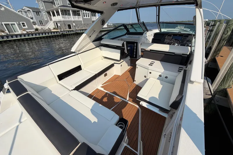 Slide: The Image of 2017 Monterey 378SE Super Express boat interior with luxurious seating and modern dashboard. - 7