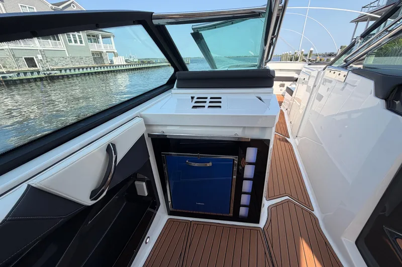 Slide: The Image of 2017 Monterey 378SE Super Express boat interior with sleek design and waterfront view. - 16