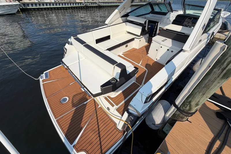 Slide: The Image of 2017 Monterey 378SE Super Express boat with spacious deck and luxurious seating. - 3