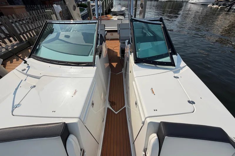 Slide: The Image of 2017 Monterey 378SE Super Express boat with sleek design, docked by the water. - 29