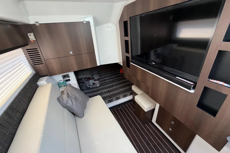 Slide: The Image of Interior of 2017 Monterey 378SE Super Express with modern furnishings and large TV. - 33