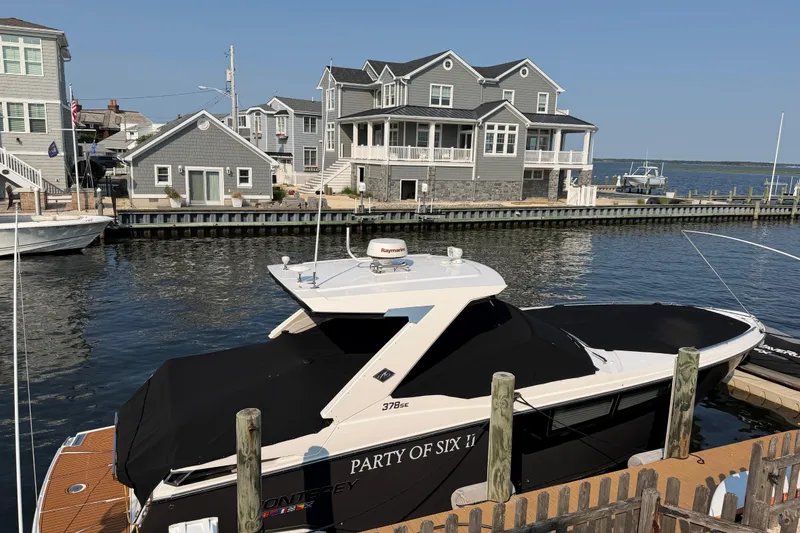 The Image of 2017 Monterey 378SE Super Express docked near waterfront homes. - 0