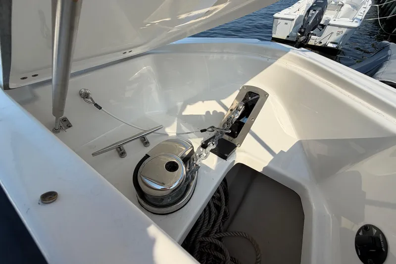 Slide: The Image of Anchor compartment of 2017 Monterey 378SE Super Express boat with winch and ropes. - 43