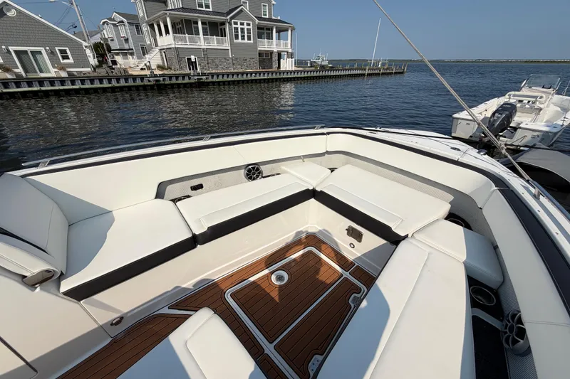 Slide: The Image of Luxurious seating on 2017 Monterey 378SE Super Express boat docked by waterfront homes. - 27