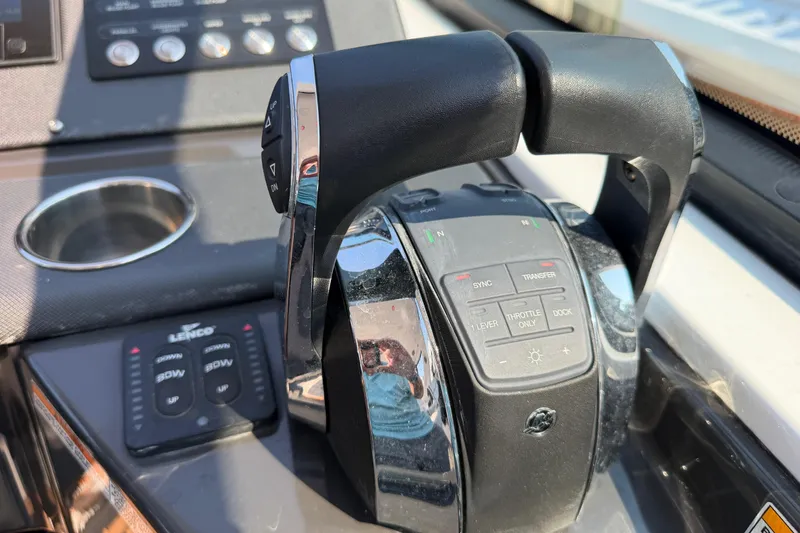 Slide: The Image of Throttle controls on a 2017 Monterey 378SE Super Express boat dashboard. - 23