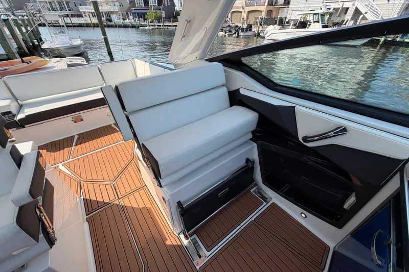 Slide: The Image of Luxurious interior of 2017 Monterey 378SE Super Express boat with sleek seating and wood flooring. - 14