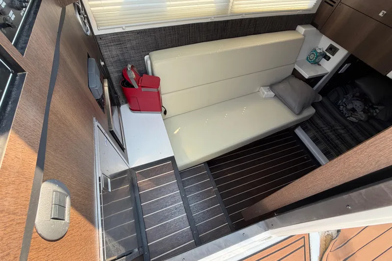 Slide: The Image of Interior of 2017 Monterey 378SE Super Express with beige seating and modern decor. - 31