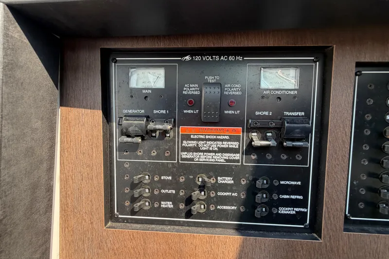Slide: The Image of Electrical control panel on a 2017 Monterey 378SE Super Express boat. - 41