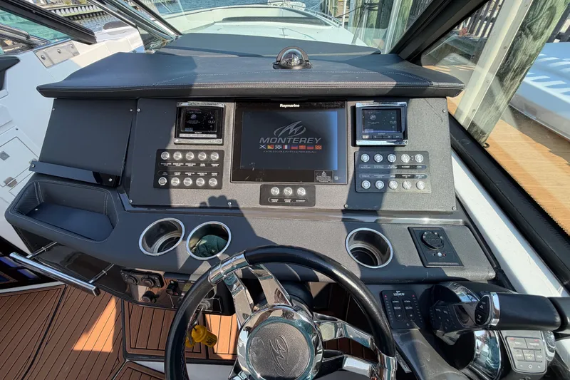 Slide: The Image of Cockpit of 2017 Monterey 378SE Super Express with modern controls and steering wheel. - 21