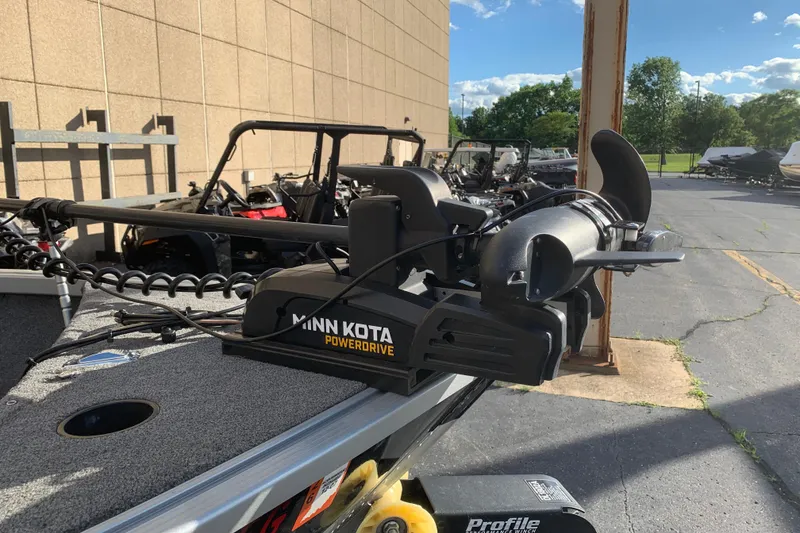 Slide: The Image of Minn Kota PowerDrive trolling motor on 1993 Alumacraft Trophy 175 boat, parked outdoors. - 3