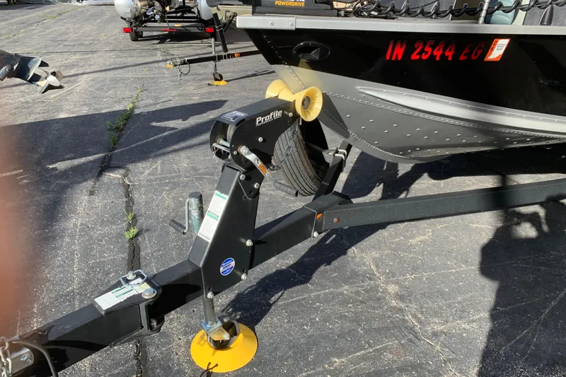 Slide: The Image of Trailer hitch of a 1993 Alumacraft Trophy 175 boat on pavement. - 4
