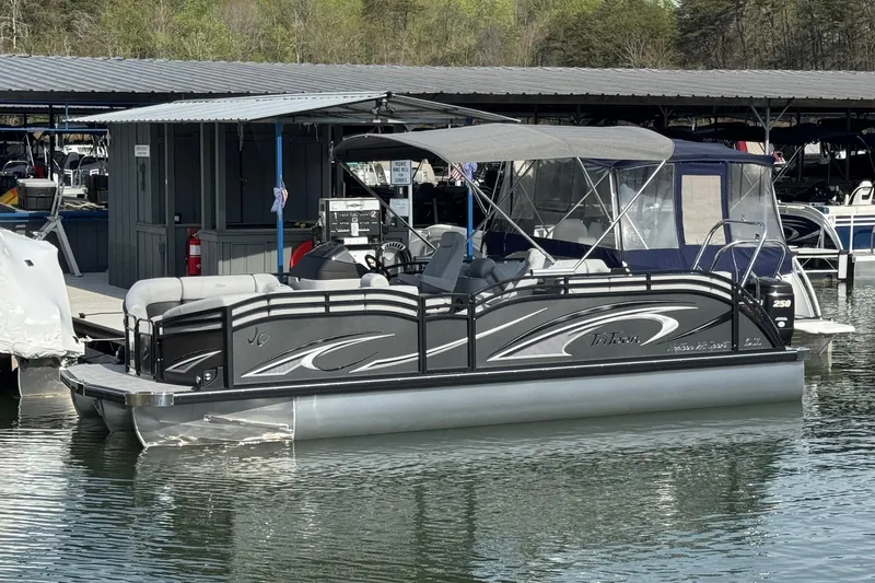 The Image of 2026 JC Neptoon Sport 23TT DSL pontoon boat docked at marina. - 1