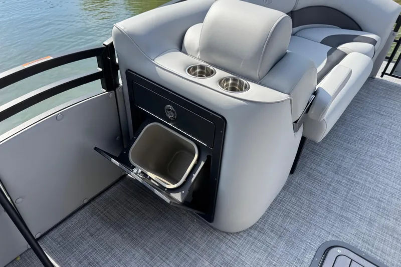 Slide: The Image of 2026 JC Neptoon Sport 23TT DSL boat interior with seating, cup holders, and storage compartment. - 10