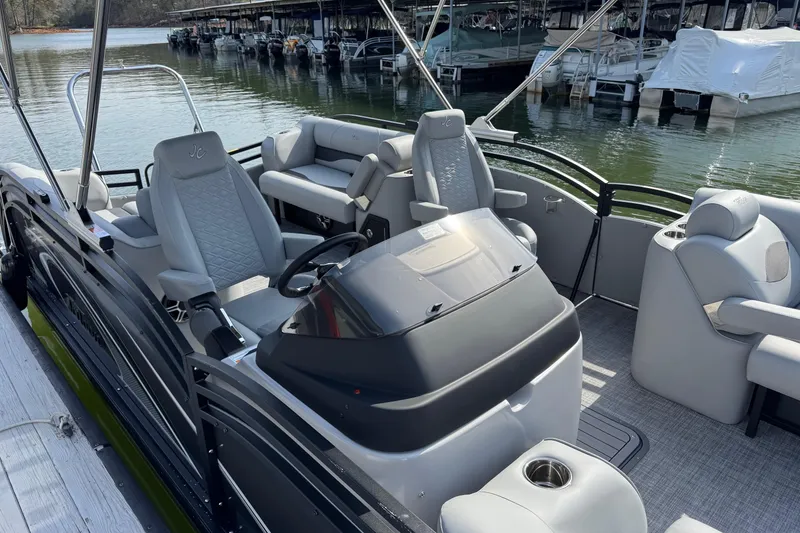 Slide: The Image of 2026 JC Neptoon Sport 23TT DSL pontoon boat with luxurious seating and sleek design. - 2