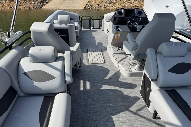 Slide: The Image of Interior of 2026 JC Neptoon Sport 23TT DSL pontoon boat with modern seating and helm. - 3