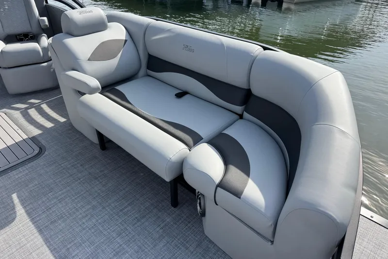 Slide: The Image of Luxurious seating on 2026 JC Neptoon Sport 23TT DSL pontoon boat by the water. - 5