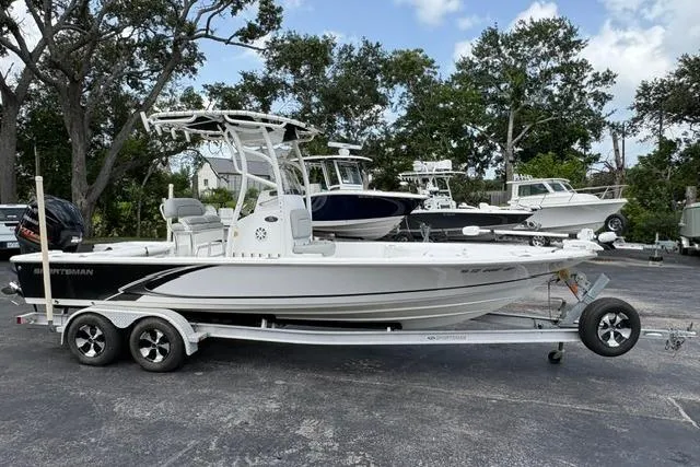Slide: The Image of 2016 Sportsman Tournament 234 Bay Boat on trailer, parked outdoors. - 1